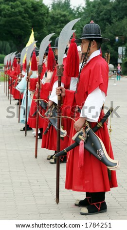 Royal guards holding swords during the changing of the guard ceremony at Gyeongbokgung Palace, Seoul, South Korea