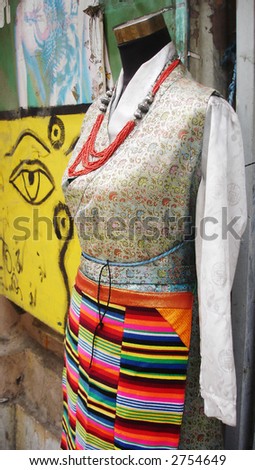 Mannequin wearing colorful ethnic clothing - fashion and beauty.