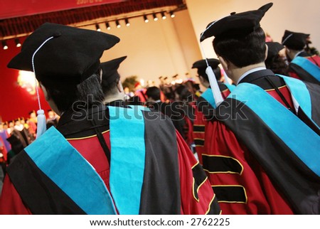 University graduates in gowns at a graduation ceremony