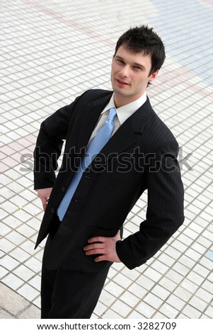 Confident young businessman in a suit and tie