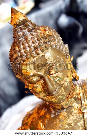 Close-up of a gold Buddhist statue in Thailand - travel and tourism