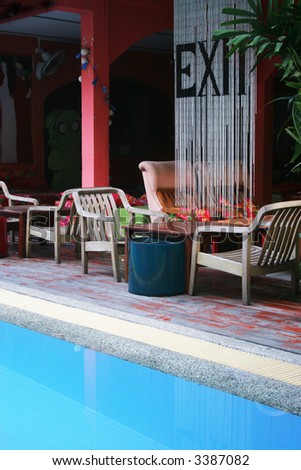 Furniture next to the swimming pool