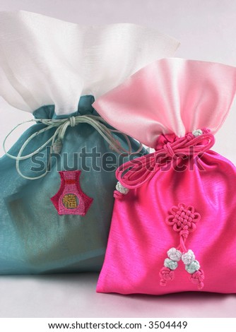 Pretty pink and green Asian bags