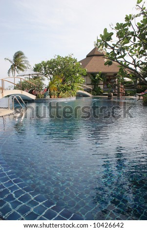Swimming pool and gardens at a tropical resort in Thailand.