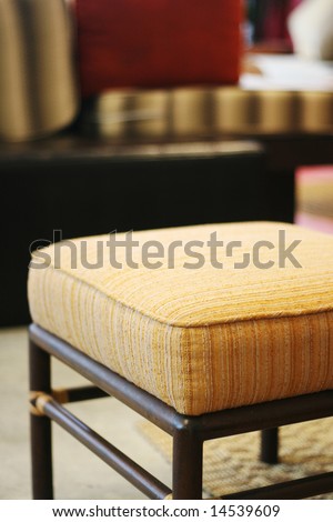 Close-up of a foot chair in a modern home.