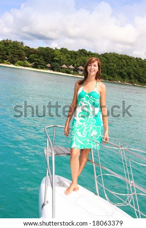 Beautiful woman aboard a luxury yacht charter.