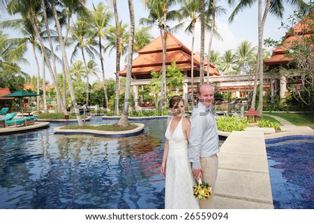 Bride and groom on their special day - tropical destination wedding.