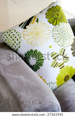 Close-up of floral patterned pillows on a sofa - modern home interiors.