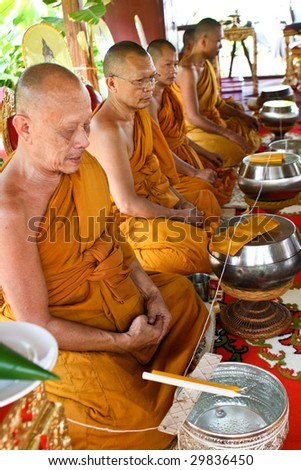 KOH LANTA - DECEMBER 2: Monks chant during a religious ceremony on December 2, 2008 in Koh Lanta, Thailand.