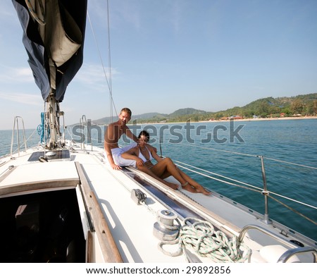 http://image.shutterstock.com/display_pic_with_logo/53073/53073,1241794878,2/stock-photo-happy-couple-relaxing-on-a-luxury-yacht-29892856.jpg