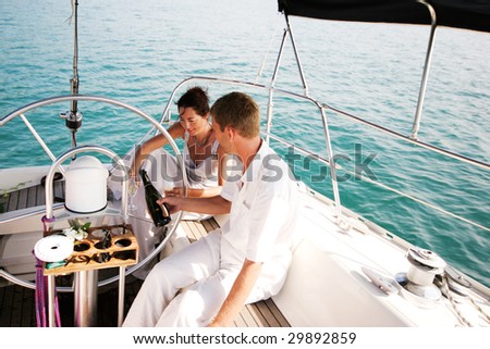Happy bride and groom on a luxury yacht.