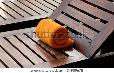 Close-up of towels at a luxury swimming pool at a tropical resort spa.