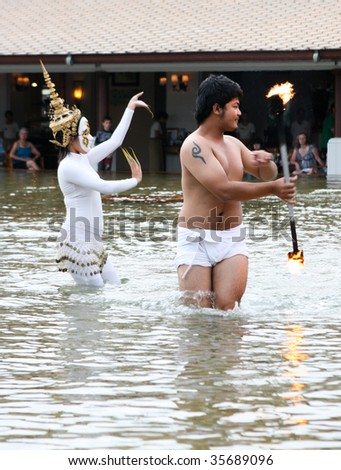 PHUKET - AUGUST 19: Traditional Thai dancers perform a ceremony in the water on August 19, 2009 in Phuket, Thailand.