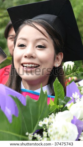 Beautiful Asian university graduate celebrates her success.