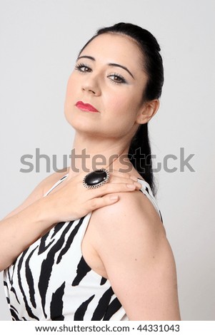 Beautiful woman in a zebra print dress - isolated.