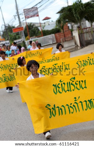 PHUKET - SEPTEMBER 16: unidentified students during a parade marking the birthday of monk  Luang Pu Supha who is 114 on September 16, 2010 in Phuket, Thailand. Many Thais believe he is the world\'s oldest man.
