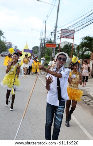 PHUKET - SEPTEMBER 16: unidentified students during a parade marking the birthday of monk  Luang Pu Supha who is 114 on September 16, 2010 in Phuket, Thailand. Many Thais believe he is the world's oldest man.