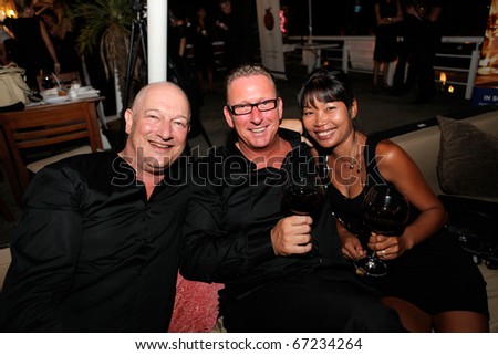 PHUKET - NOVEMBER 28: Guests at Black Is Back, a show in aid of the charity Life Home Project Phuket and the Sunshine Village Yacht Association on November 28, 2010 in Phuket, Thailand.