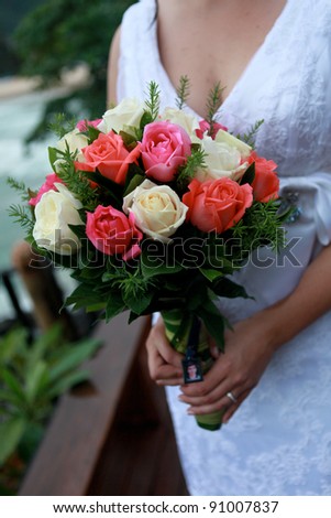 Close-up of a bride holding her wedding bouquet.