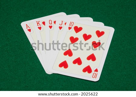 the flush royal combination on green cloth background