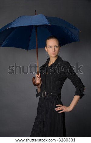 the young attractive woman with big umbrella