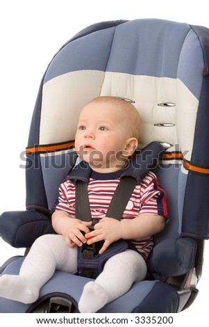 the small boy in auto armchair isolated on white