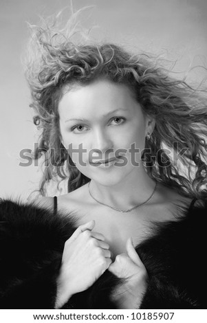 young woman in fur coat, black and white