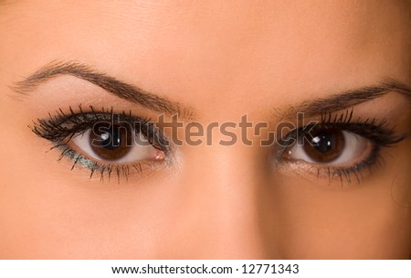female wide open eyes with long eyelashes macro