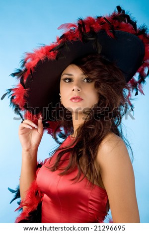 closeup portrait of beautiful woman in hat with plumage