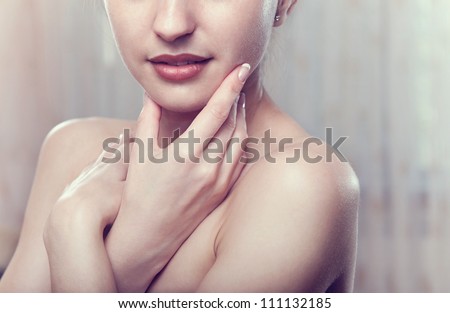 Perfect skin concept. Portrait of beautiful girl over light background