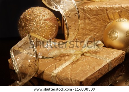Golden set of Christmas decorations over deep dark background