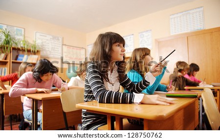 Schoolchildren During Lesson In Classroom.