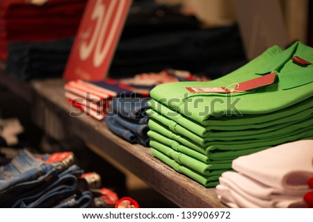 Various Color Shirts At Shelf In Shop