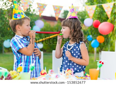 Two Happy Children Having Fun At Birthday Party