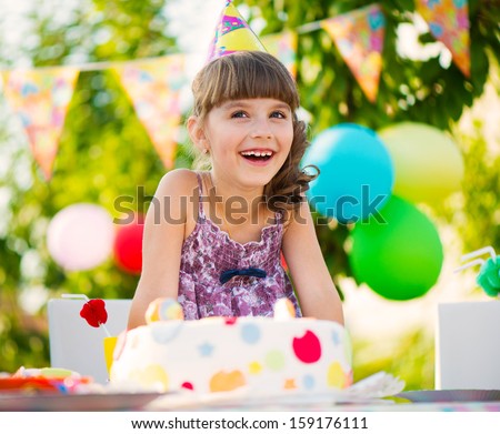 Happy Pretty Girl With Cake At Birthday Party