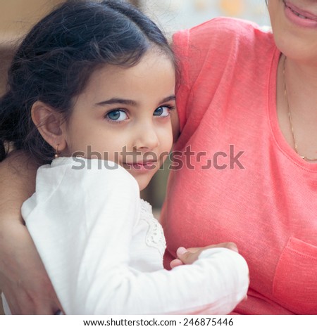 Portrait of lovely hispanic mother and daughter
