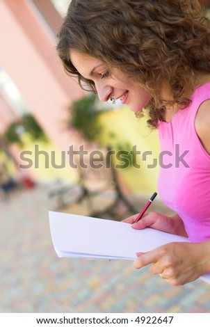 Businesswoman is preparing for annual report outdoors
