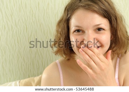 Funny woman portrait in her bedroom