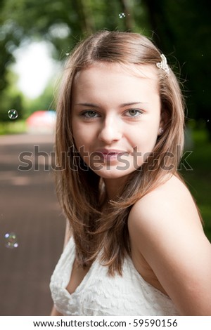 Outdoor girl portrait in park. Strobist photo style.