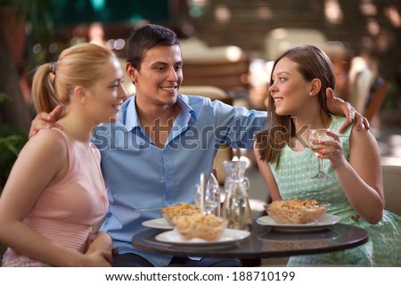 Friends eating dinner in a Italian restaurant