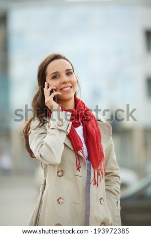 Beautiful young woman on the street on the phone
