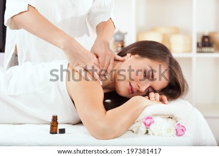 Young woman having aromatherapy massage.