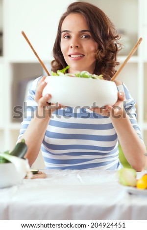 Woman making salad