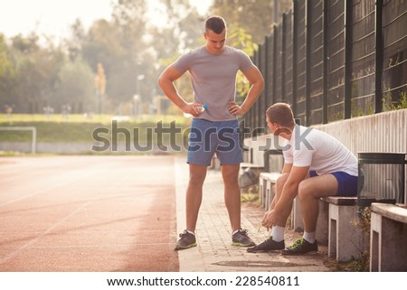 Two young men before or after sport training