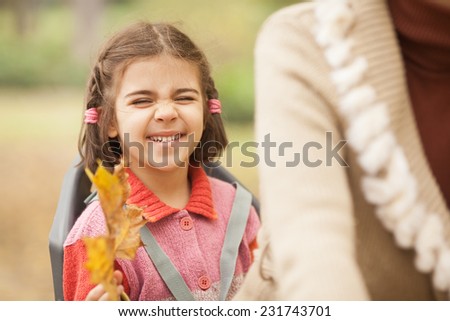 Little girl making funny face during a bike drive