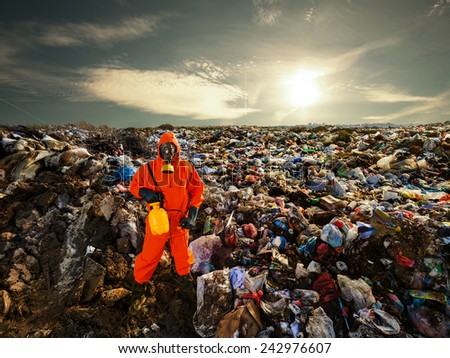 Recycling worker standing on the landfill
