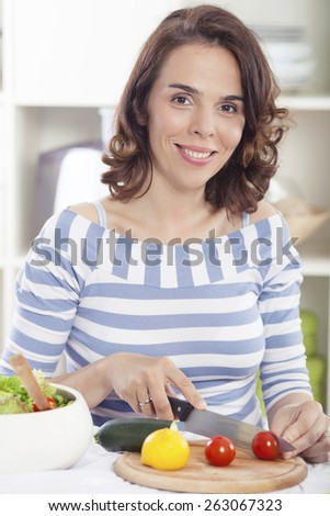 Smiling young woman preparing healthy meal