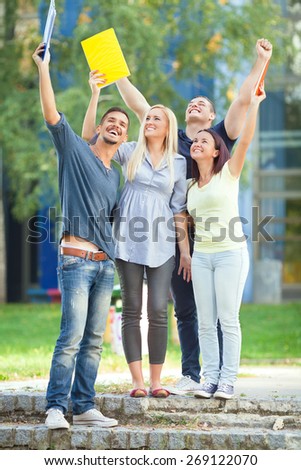 Group of happy college students after finishing final exams