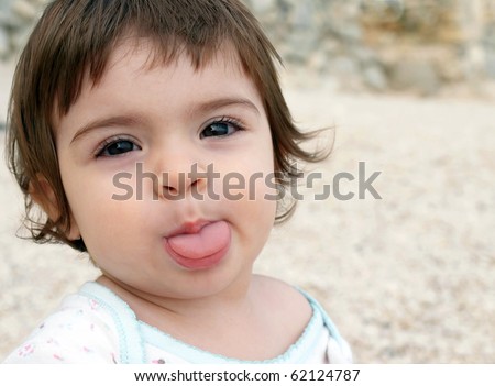 Cute little girl stick out a tongue