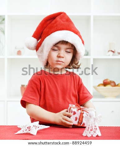 Cute little toddler wishing a Christmas wish with eyes closed